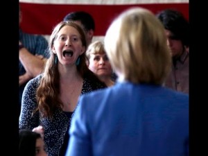 Protesters begin chanting "Act On Climate! Act On Climate!" after a young woman asked if Clinton's "refusal to take leadership on climate change" was due to the fact that "you have contributions from the fossil fuel industry in your campaign”.