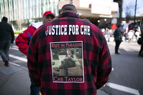 A friend of Che Taylor stands near the demonstration in front of Seattle Police HQ. Credit: Alex Garland/The Stranger