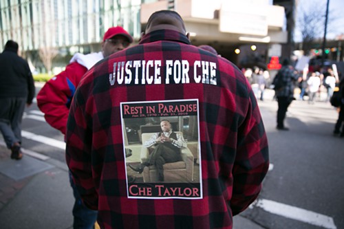 Justice For Che A friend of Che Taylor stands near the demonstration in front of Seattle Police HQ. Credit: Alex Garland/The Stranger