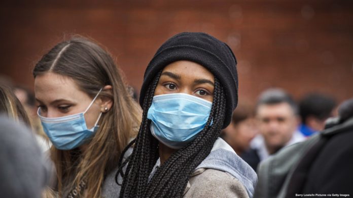 Women_Coronavirus Young women wear face masks as protection against the coronavirus during Chinese New Year celebrations in London on January 26, 2020. Barry Lewis/In Pictures via Getty Images