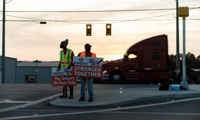 Labor organizers promote the Retail Wholesale and Department Store Union, outside an Amazon warehouse in Bessemer, Ala., on March 12, 2021. (Bob Miller/The New York Times)